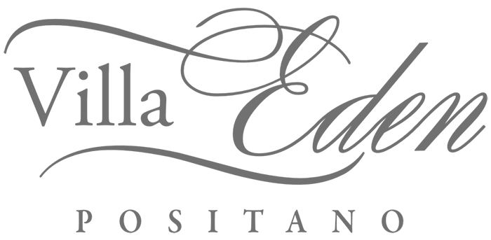 "Logo of Villa Eden with elegant script and pixelated text."